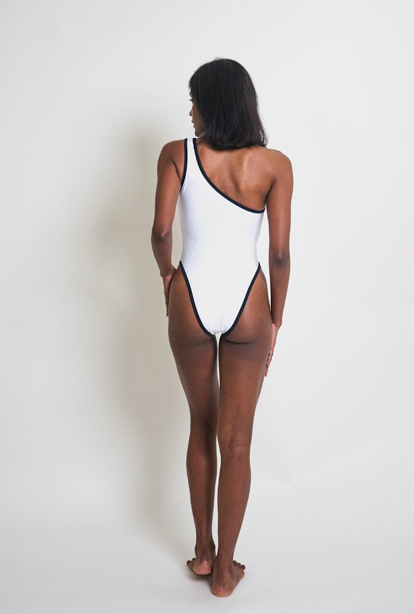 The Siren is a flattering one-shoulder swimsuit with a high thigh cut and built-in padding. Made with sustainable fabric