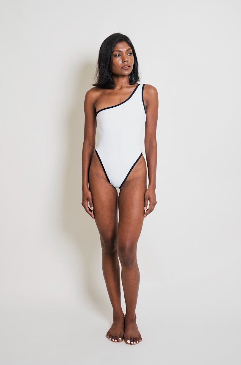 The Siren is a flattering one-shoulder swimsuit with a high thigh cut and built-in padding. Made with sustainable fabric